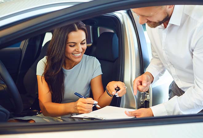 happy woman in car rental